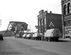 Trucks of Slinger's wine lined up on Johnson Street near Victoria Wineries building at 1400 Store Street