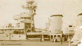 H.M.S. Capetown. Mrs. Glarpton [?] on second deck; Mr. & Mrs. Hetherington (Jim and Jean) are sitting on the dock