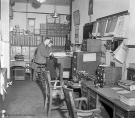 Unidentified individuals in [Police Station?] office