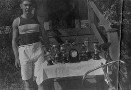 Charles Staples with cycling trophies