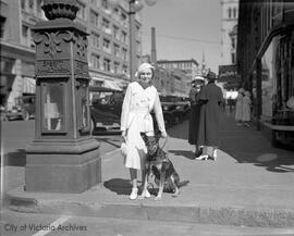 Dog leading blind girl