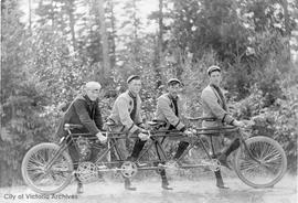 Four cyclists with a four-seater bicycle. Possibly Robillard family