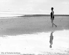 Woman in bathing suit on beach