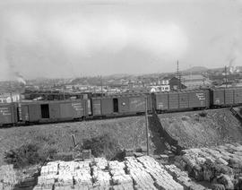 Train cars near Sidney Roofing and Paper.  Harbour Road area in background