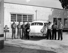 Special hand-built 14 passenger "airporter" bus with builders Stanley Davis, Clifford Simmonds, Bert Simpson, Stanley Mill, Rudy Norton, Louis Bouchard and John Norton