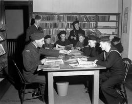 Relaxing in the library at the Salvation Army Three Services Canteen, 1318 Broad Street