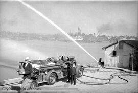 Firemen [using truck]