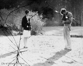 Man taking photo of a woman