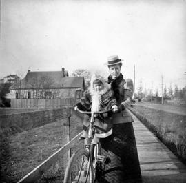 Mary Eleanor Oliver (nee Ward) and daughter Catherine on a bicycle