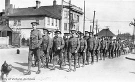 Troops marching along Quadra Street