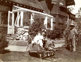 Mary Rattenbury, Nurse and Foy the gardener in the garden of 1701 Beach Drive