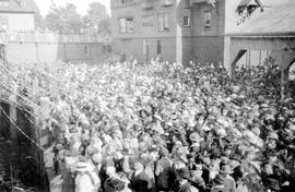 Crowd at Canadian Pacific Railway (CPR) ticket office for the departure of the 11th CMR