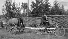 Stanley Miles, left and George Miles, right, with motorcycle