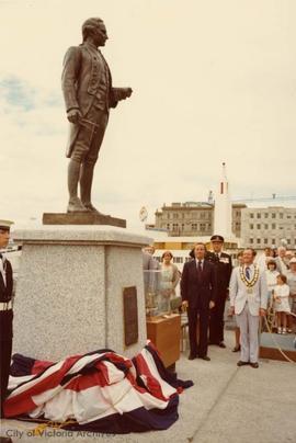 Unveiling of Captain Cook Statue along inner harbour causeway. Premier W. Bennett and Mayor Young (standing, L-R)