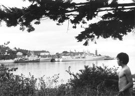 First Nations boy looks across Esquimalt harbour