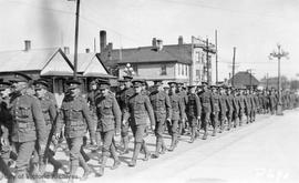 Troops marching on Quadra Street looking north east from south of Fort Street