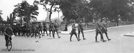 Troops marching by Quadra Street Cemetery